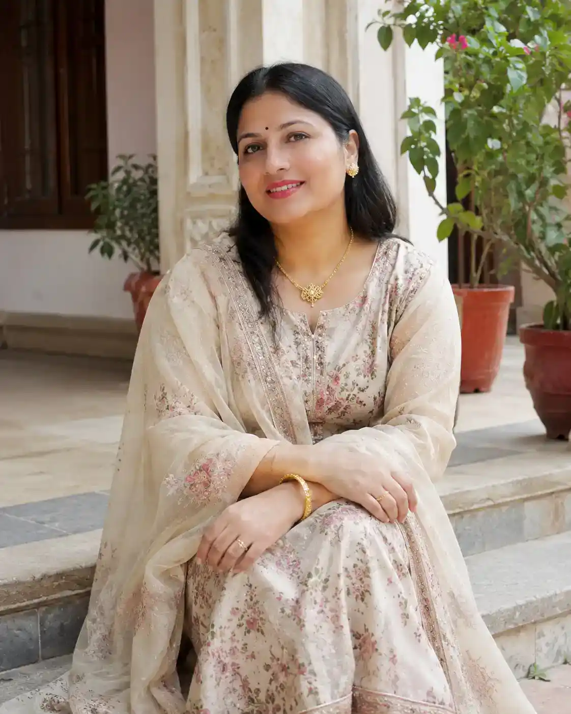 Happy customer wearing elegant floral ethnic suit by Pehrava